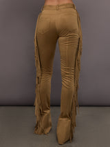 Model is wearing the Fringe Spat Jeans in Camel, back view with pocket detail.