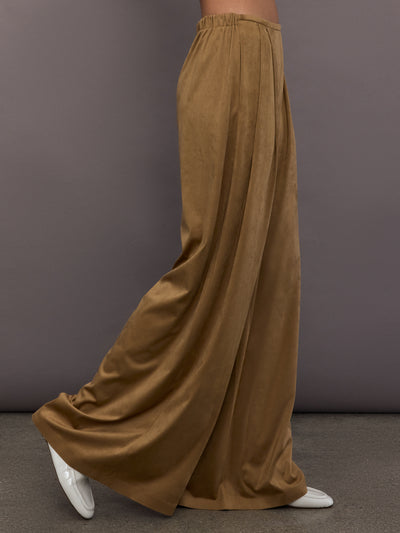 Model is wearing the Pleat Pant in Camel, full body front view.