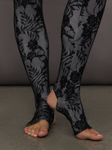 Detailed view of Long Sleeve Slim Fit Turtle Catsuit with Footie Black White Lace stirrup hem at ankles.