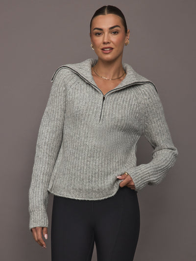Model wearing Half-Zip Ribbed Knit Sweater in heather grey, front view.