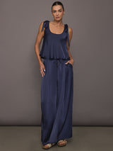 Model wearing Satin Tie Shoulder Tank Top in navy styled with drawstring pants, front view.