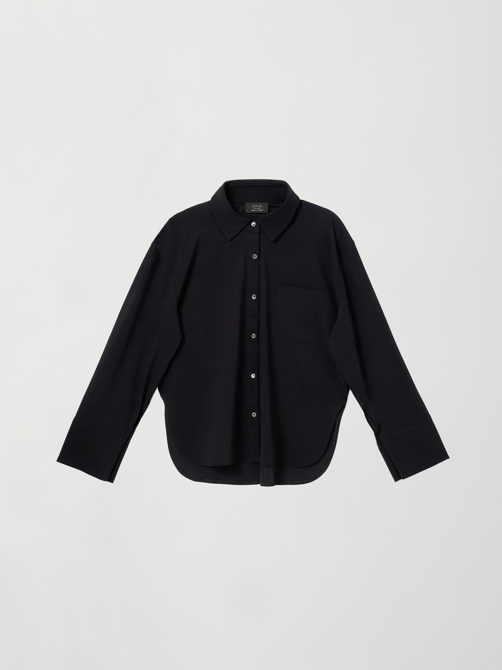 Flat lay of Oversized Stretch Button-Down Shirt in black on white background.
