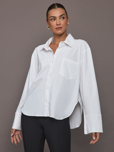 Model wearing Oversized Cotton Button-Down Shirt in white, front view.