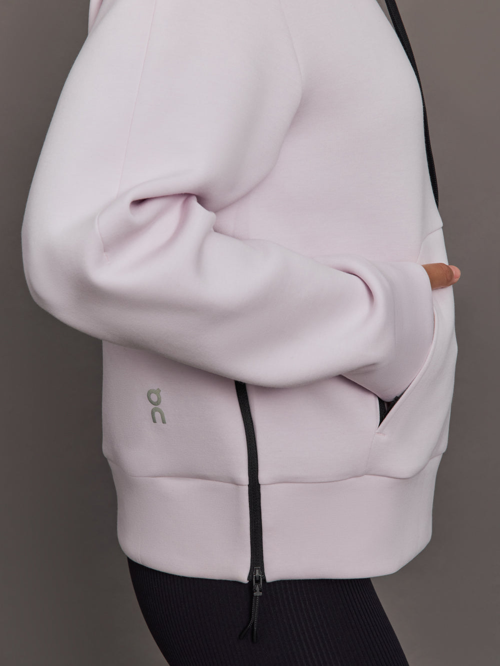 Light purple jacket with a zipper on a neutral background