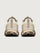 Pair of beige hiking shoes with gray accents on a light gray background