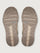Pair of brown shoe soles on a light gray background