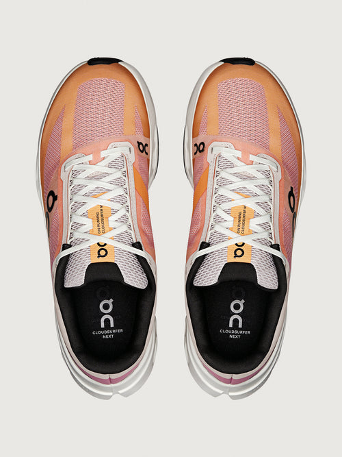 Cloudsurfer running shoes with tangerine and ivory colors.