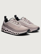 Gray and purple athletic shoe on a white background