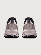 Gray and purple athletic shoe on a white background