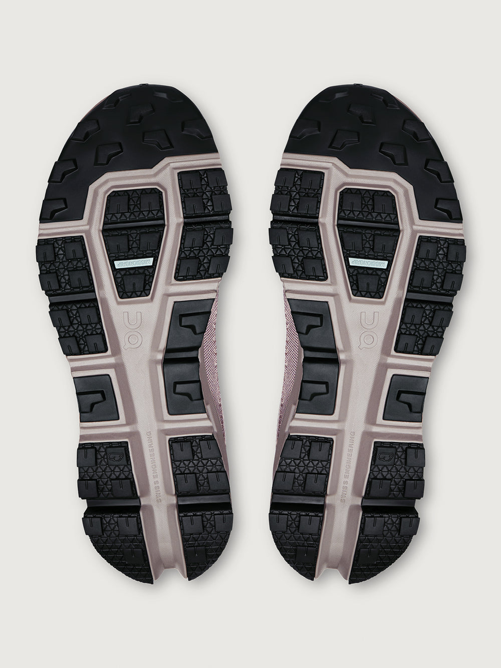 Gray and purple athletic shoe on a white background