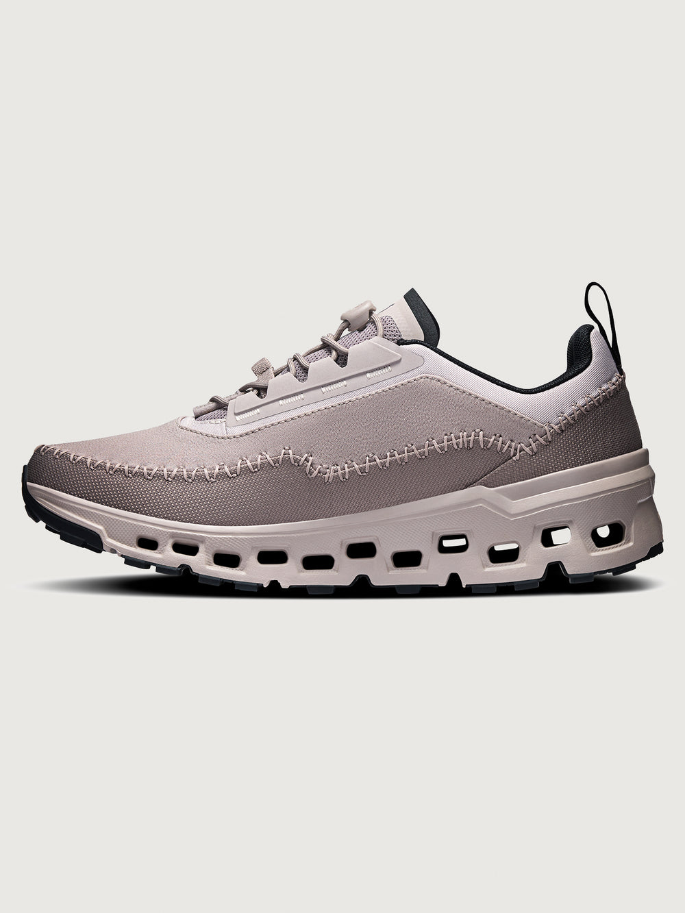 Gray and purple athletic shoe on a white background