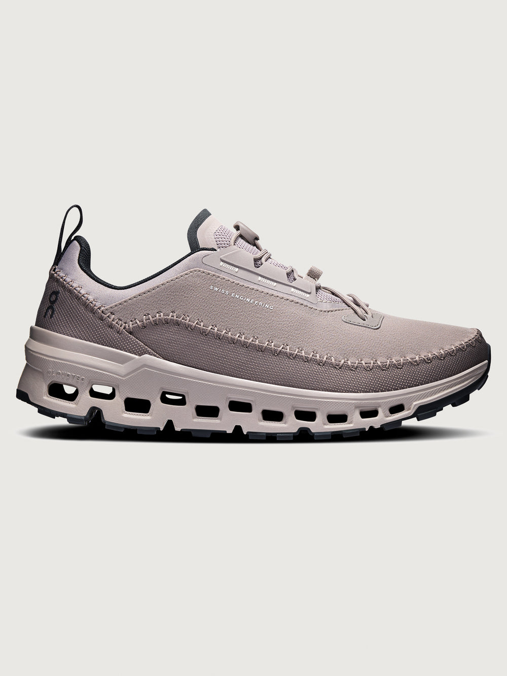 Gray and purple athletic shoe on a white background