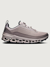 Gray and purple athletic shoe on a white background