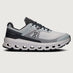 Gray and black running shoe on a light gray background