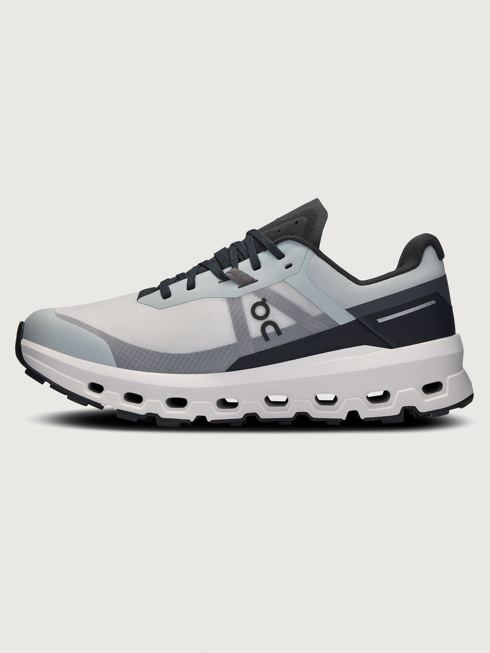 Gray and black running shoe on a light gray background