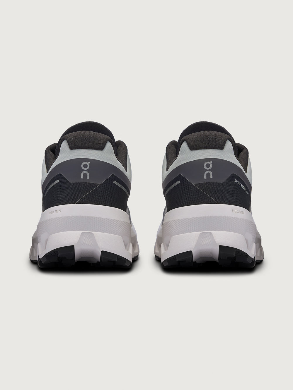 Gray and black running shoe on a light gray background