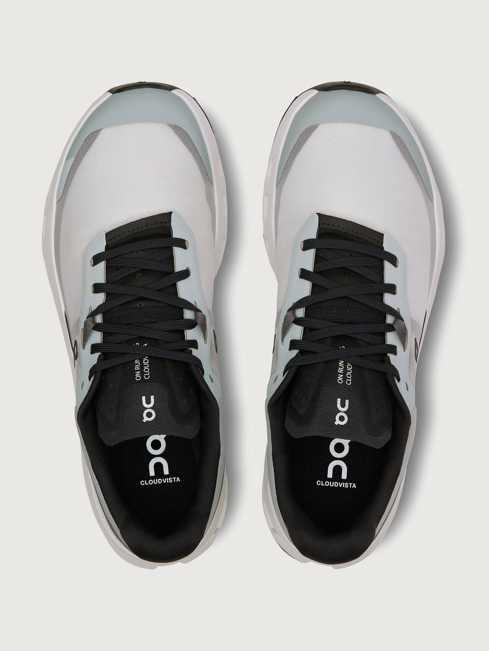 Gray and black running shoe on a light gray background