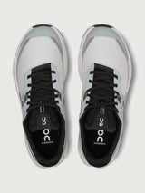 Gray and black running shoe on a light gray background