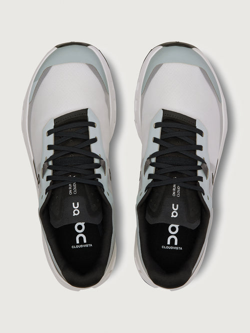 Gray and black running shoe on a light gray background