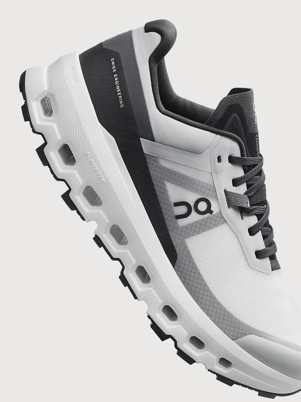 Gray and black running shoe on a light gray background