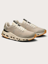 Truffle Dew-colored athletic sneakers.