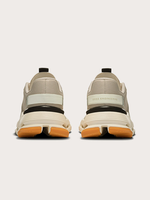 Truffle Dew-colored athletic sneakers.