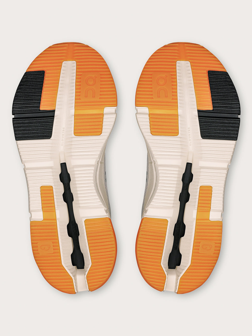 Truffle Dew-colored athletic sneakers.