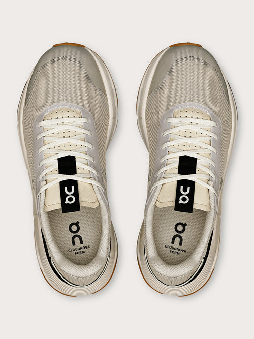 Truffle Dew-colored athletic sneakers.