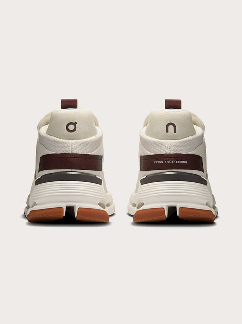 Mulberry-colored athletic sneakers.