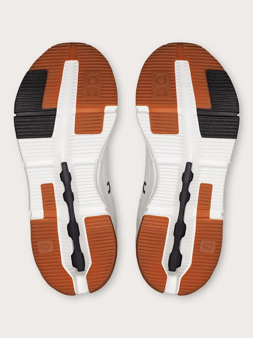 Mulberry-colored athletic sneakers.