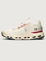 On Cloudnova 2 women’s sneakers in Ivory Grenadine, showing medial side with CloudTec® cushioning, mesh upper, and contrast sole, side view.