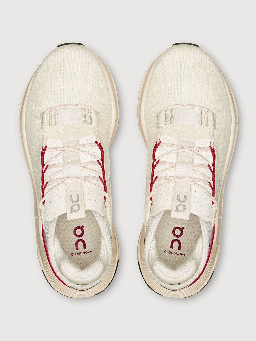 On Cloudnova 2 women’s sneakers in Ivory Grenadine, top-down view highlighting lace-up front, perforated tongue, and cushioned interior with branded insole.