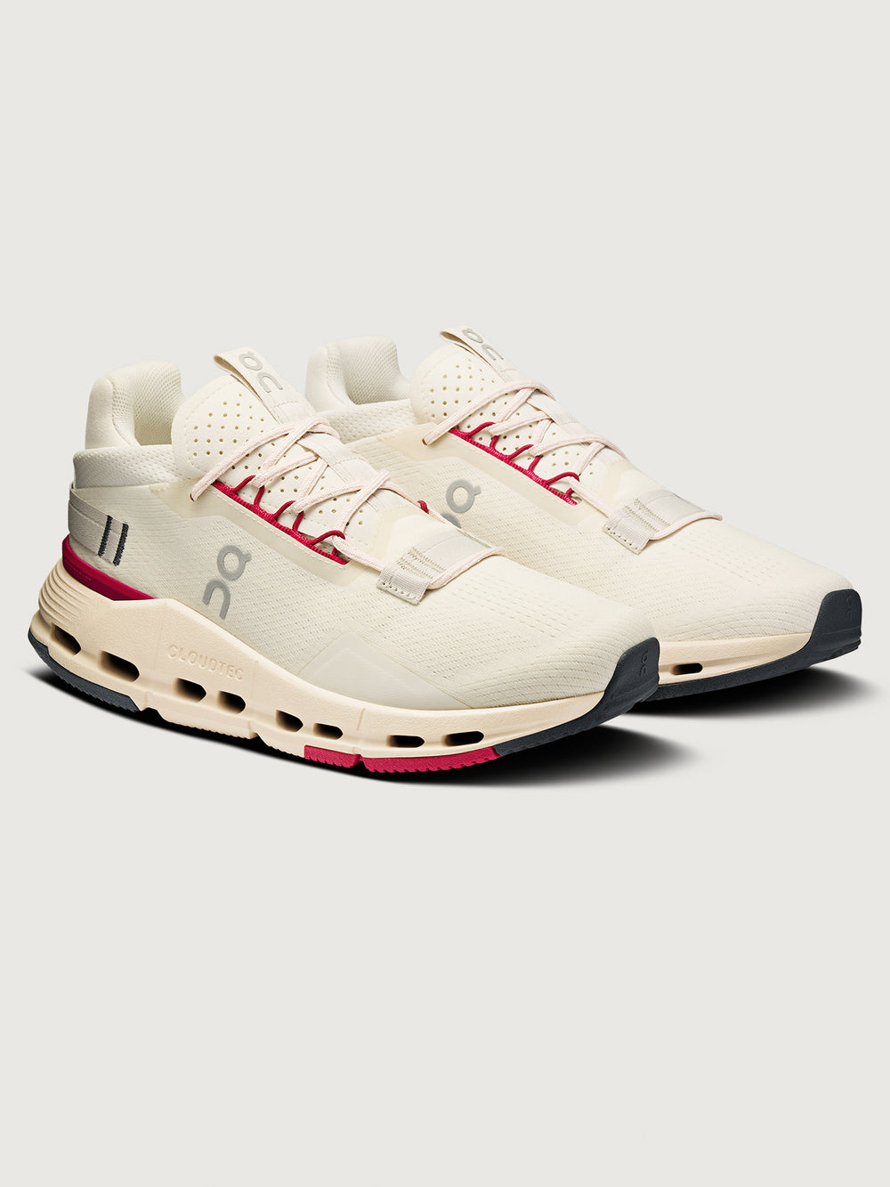 On Cloudnova 2 women’s sneakers in Ivory Grenadine, angled front three-quarter view showing mesh upper, CloudTec® cushioning midsole, and contrast outsole.