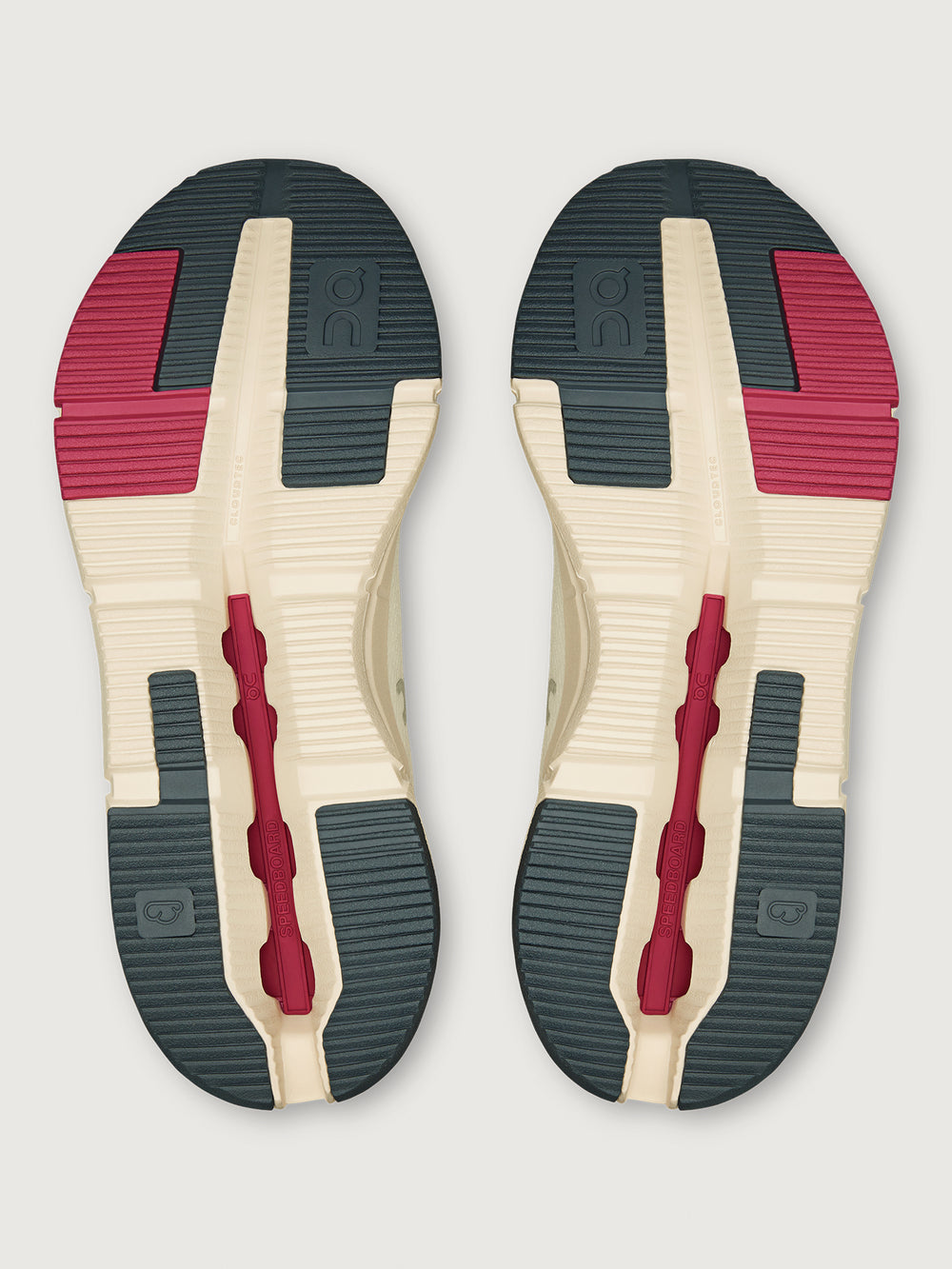 On Cloudnova 2 women’s sneakers in Ivory Grenadine, outsole view showing textured rubber tread in black, red, and ivory with Speedboard® support.