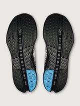 Black shoe insoles with blue accents on a light gray background