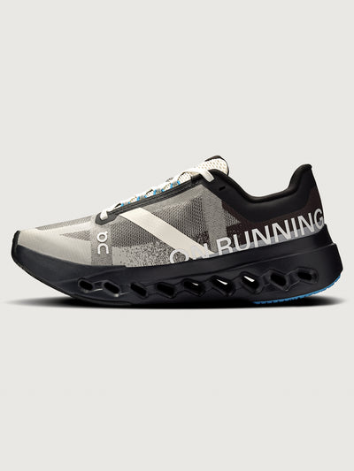 Black and gray running shoe on a light gray background
