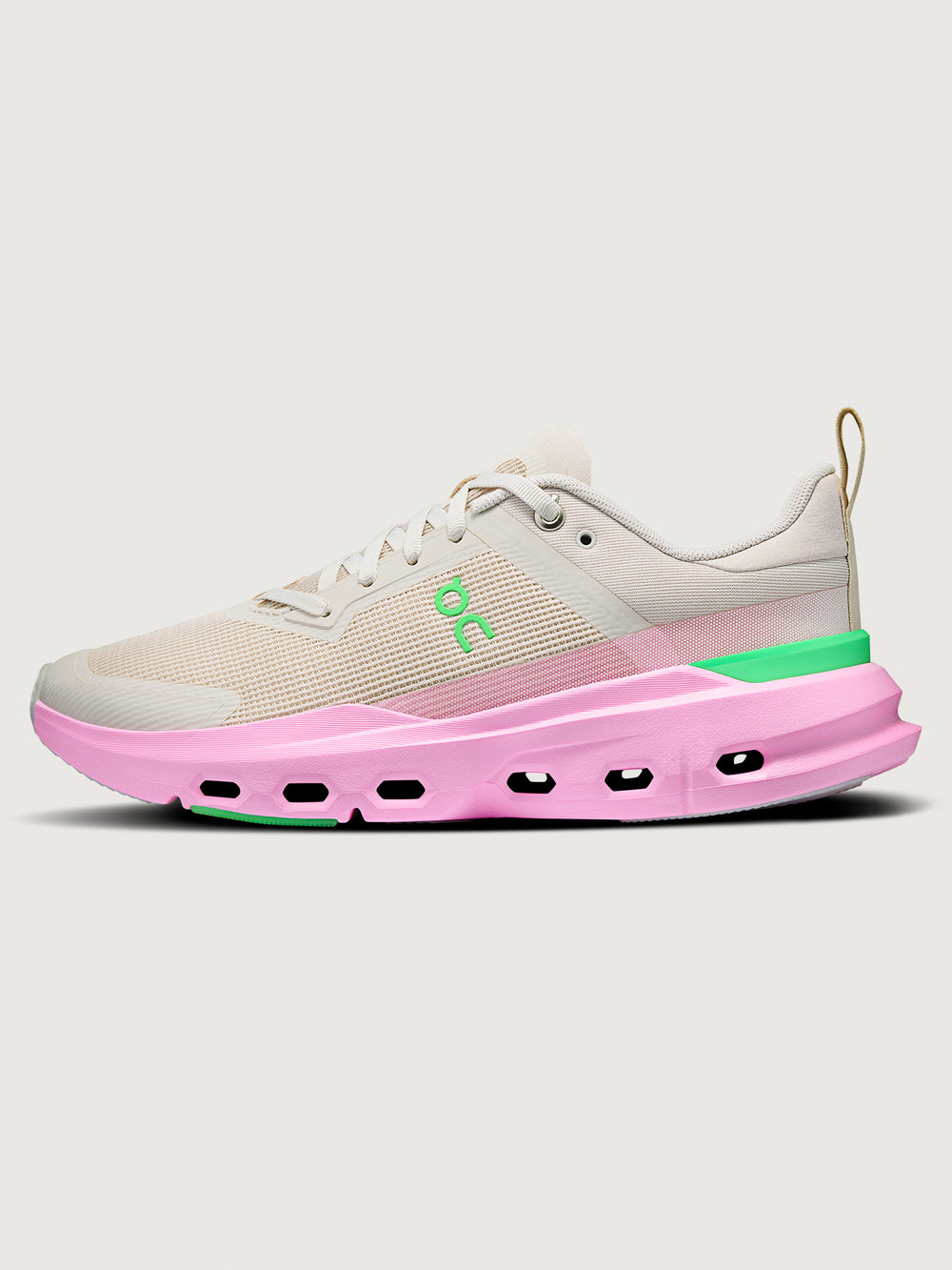 Sneaker with a pink sole and gray upper on a white background