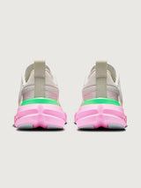 Pair of sneakers with pink soles and gray bodies on a white background
