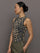Model wears a full length leopard print patterned sleeveless muscle tank.