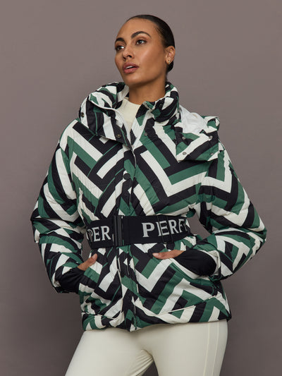 Front view of model wearing Cortina Ski Parka Waffle Print Green with belted waist.
