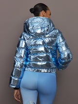 Back view of Polar Flare Ski Jacket III Light Blue Foil with quilted puffer design and hood.