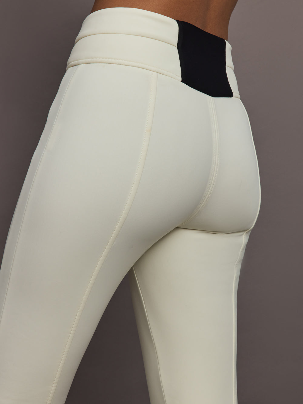 Close up of Aurora High Waist Ski Pant Snow White showing high waist seam and panel details.