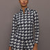 Front view of model wearing 1/4 Zip Base Layer Top in black and white houndstooth print.