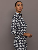 Side profile of 1/4 Zip Base Layer Top in black and white houndstooth print with long sleeves.