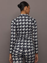 Back view of 1/4 Zip Base Layer Top in black and white houndstooth print with slim fit design.