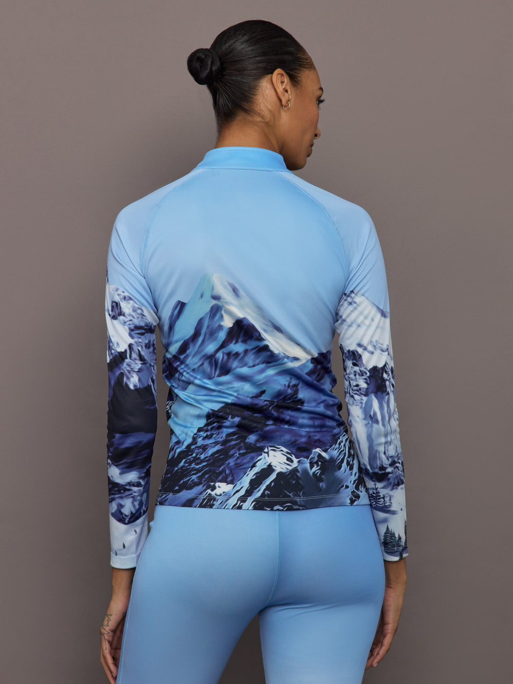 Back view of 1/4 Zip Base Layer Top in Ski Lift Blue showing full mountain landscape design.