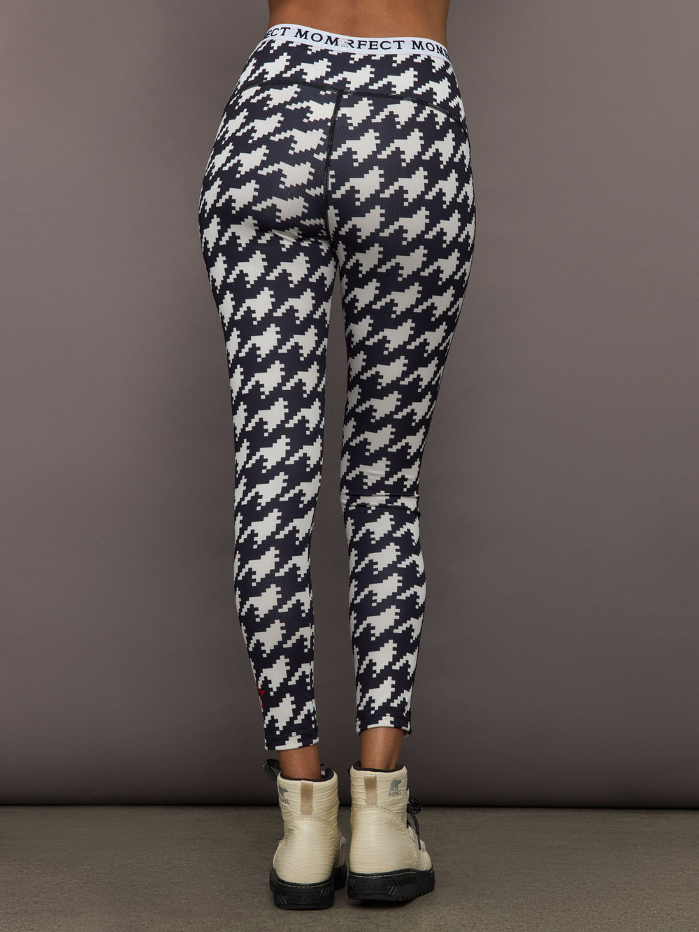 Back view of Printed Base Layer Leggings in black and white houndstooth print with Perfect Moment logo waistband.