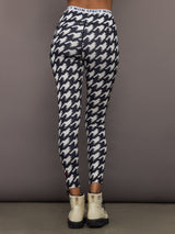 Back view of Printed Base Layer Leggings in black and white houndstooth print with Perfect Moment logo waistband.