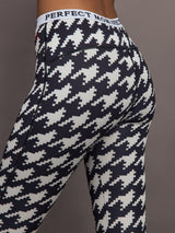 Close up of Printed Base Layer Leggings in black and white houndstooth print showing textured detail.