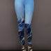 Front view of model wearing Printed Base Layer Leggings in Ski Lift Blue with mountain graphic design.